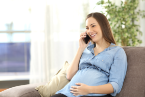 A prenatal women calling for a chiropractic appointment.