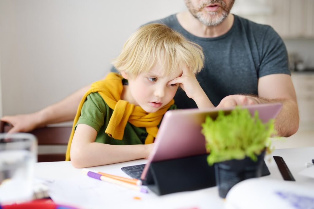 ADHD-dad-helping-struggling-son-do-homework