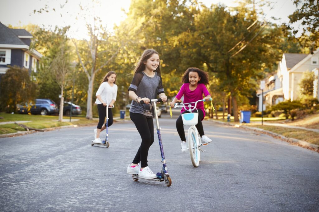 girls riding scooters